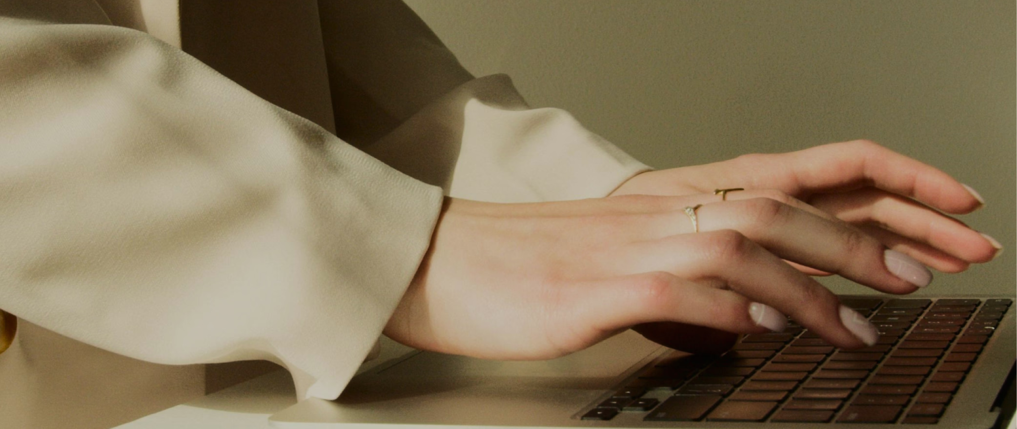 A person typing on a laptop